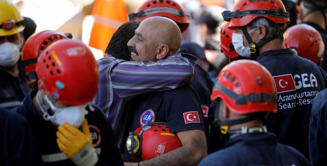 A Grateful Turkish Man Thanking Rescue Workers for Taking his 3 Children out of the Collapsed Apartment in Izmir, Turkey