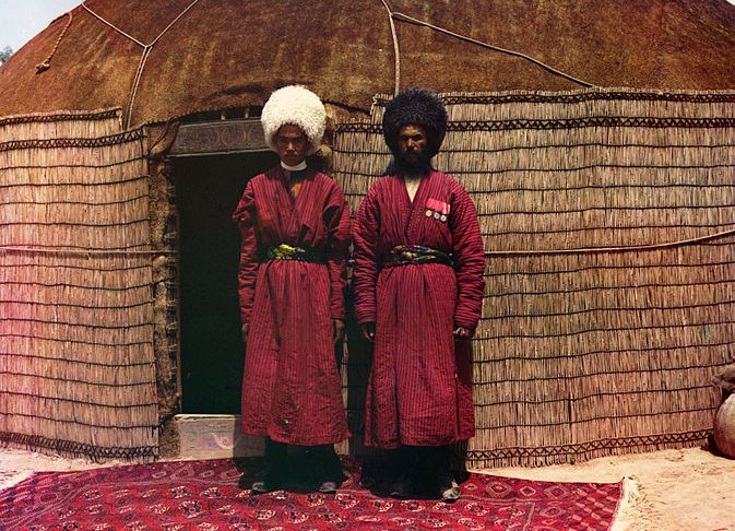 Two Turkish Nomads on a Turkish Carpet in front of a Classic Turkish Yurt