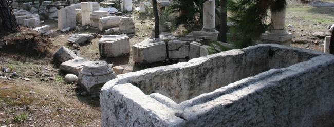 Column bases, sarcophagi, fountain and arch ruins in modern Thyateira today
