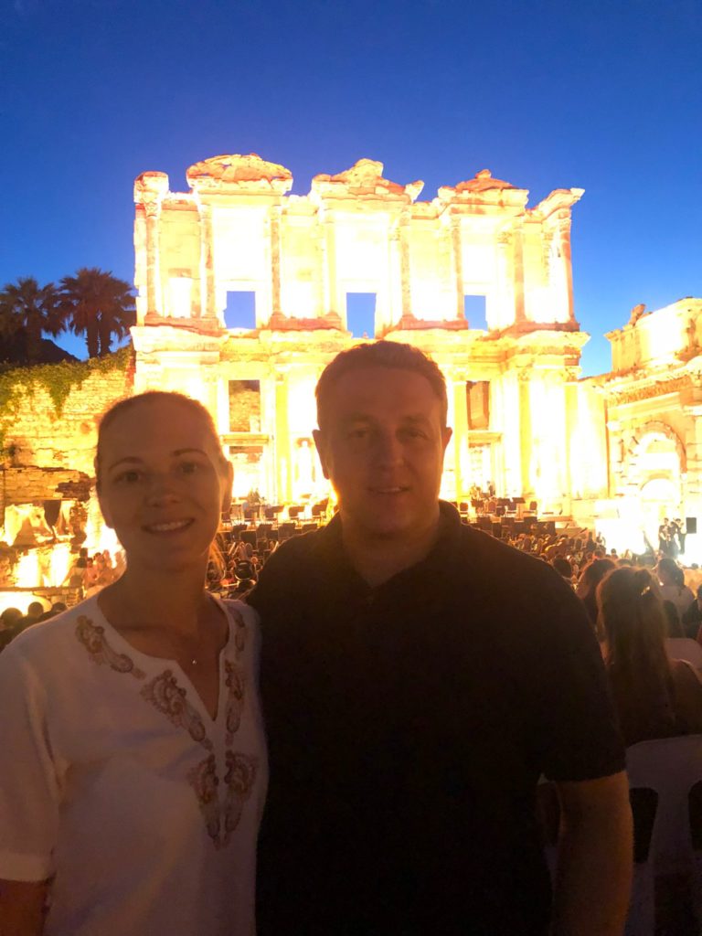 Hasan and Valeriya Gülday in front of Celsus Library of Ephesus during a Night Tour in Ephesus