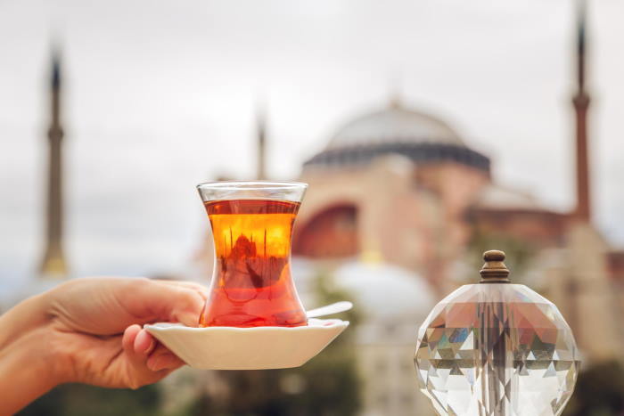 A Glass Of Turkish Tea In Front of Hagia Sophia