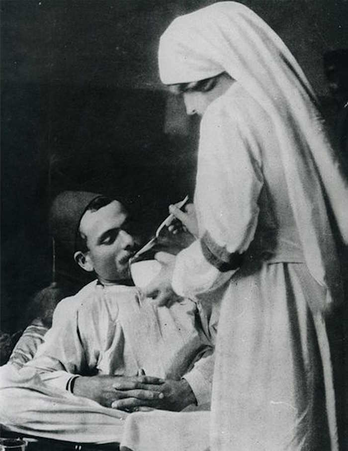 An Ottoman Nurse Feeding A Wounded Ottoman Soldier During The First World War