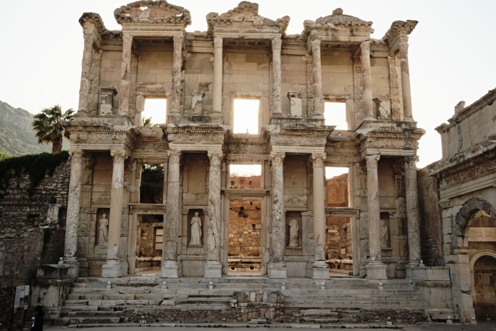 Recommended Books about Ephesus 3 Two-story facade of the Library of Celsus in Ephesus lit by warm low sun, with columns and statues in niches