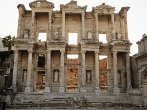 Two-story facade of the Library of Celsus in Ephesus at sunset, the area where slabs of the Parthian Monument were found