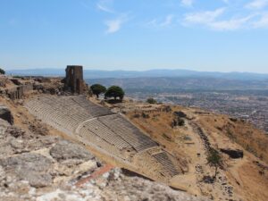 The steep theater of Pergamon on the acropolis hill above modern Bergama