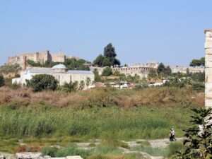 The single re-erected column of the Temple of Artemis, the temple of Diana, with Ayasuluk Hill behind it