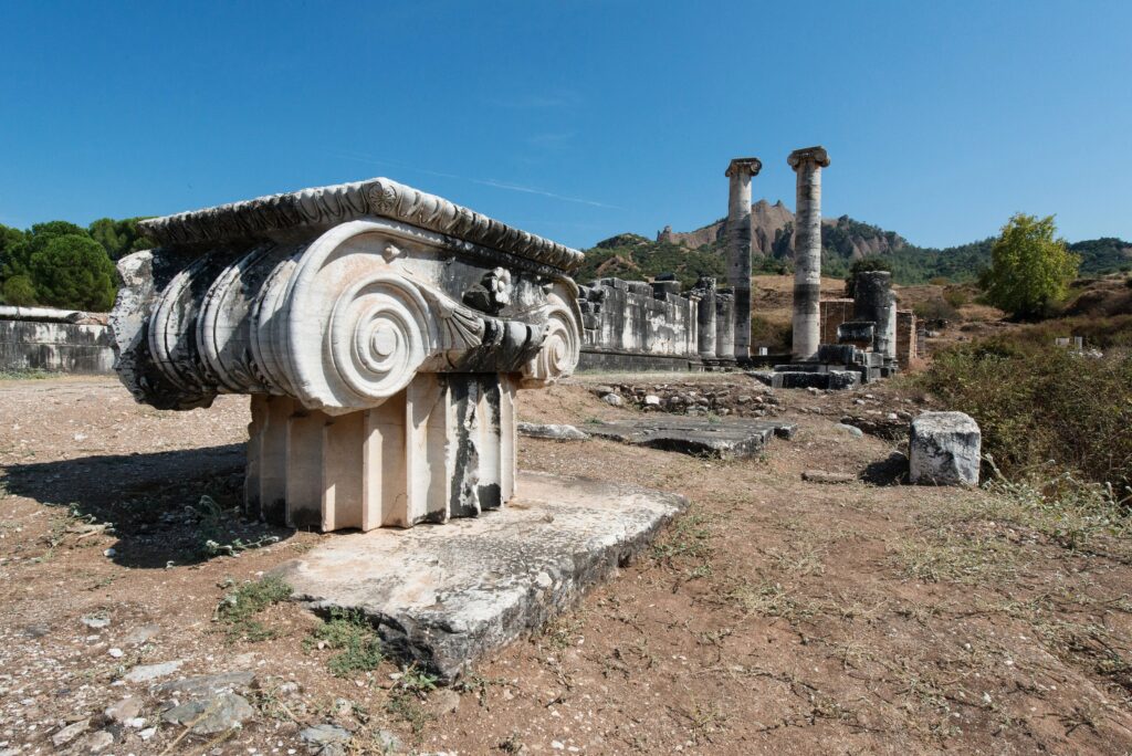 The Seven Churches Today: Modern Names, Locations, and How to Visit Them 10 Carved Ionic capital in front of the two standing columns of the Temple of Artemis at Sardis, one of the seven churches of Revelation
