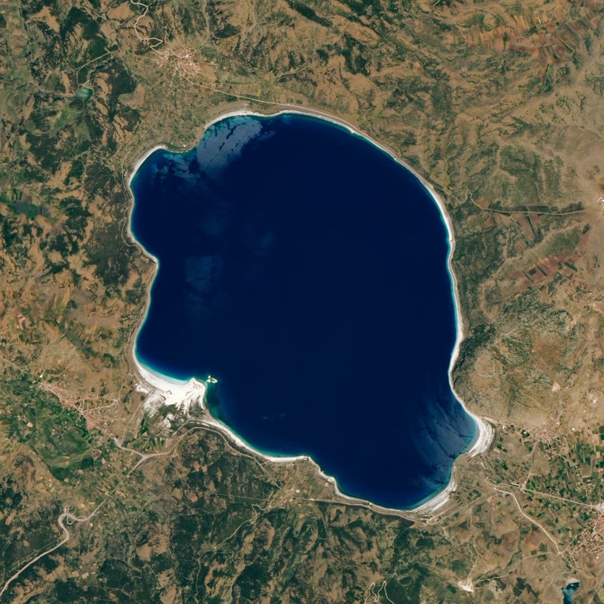 Lake Salda 7 Satellite view of Lake Salda in June 2020, a dark blue lake with pale white patches along its shore, surrounded by brown and green hills